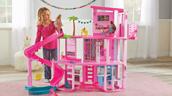 Child Playing with Barbie Dreamhouse with 3 Story Slide