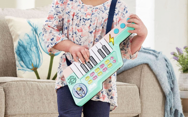 Girl Playing with VTech Bluey Blueys Keytar Toy