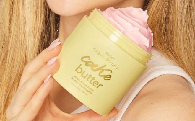 Hand Holding Tarte Whipped Body Butter