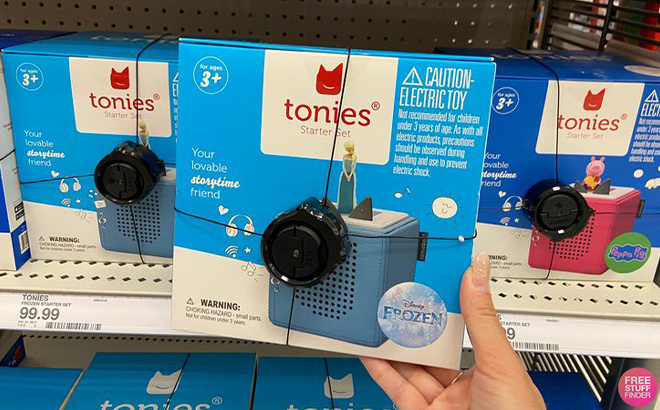 Hand Holding Tonies Disney Frozen Toniebox Audio Player Starter Set at Target