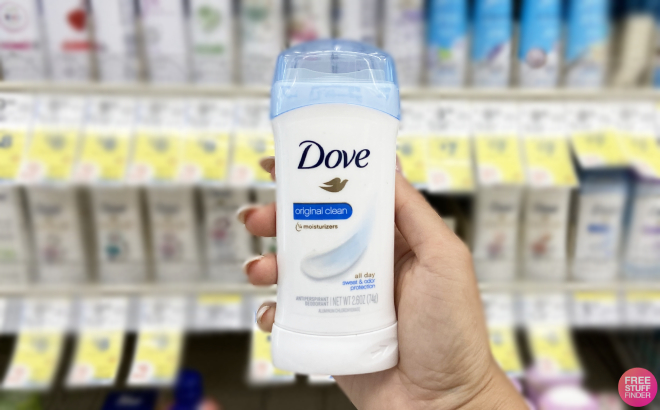 Hand Holding a Dove Invisible Solid Antiperspirant Deodorant Stick