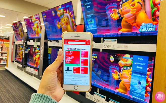 Hand Holding a Mobile Phone Showing Target Black Friday TV Deals