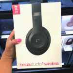 Hand holding Beats Studio3 Wireless Noise Cancelling Headphones Black