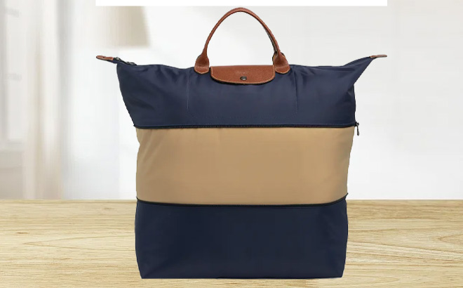 Longchamp Le Pliage Large Travel Bag on a Table