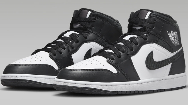 Nike Mens Air Jordan 1 Mid SE Shoes on Gray Background