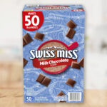 Swiss Miss Milk Chocolate Hot Cocoa Mix Packets 50 Count on a Table