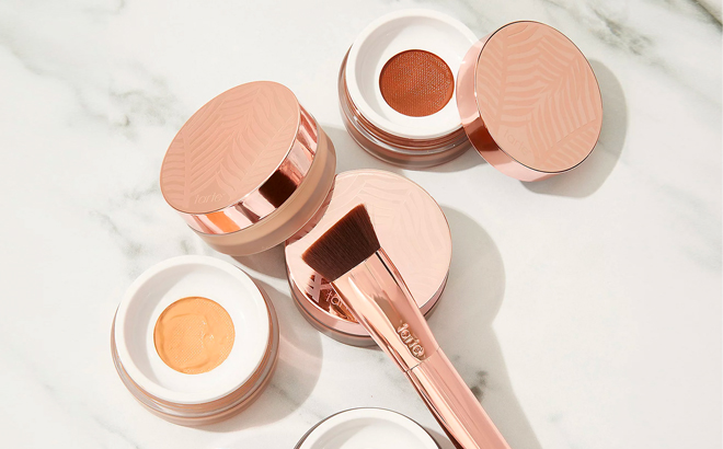 Tarte Foundation and Brush Set on a Marble Table