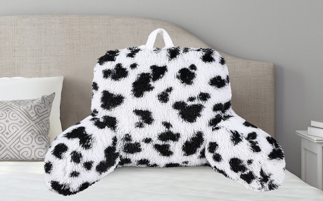 The Big One Print Faux Fur Backrest on a Bed