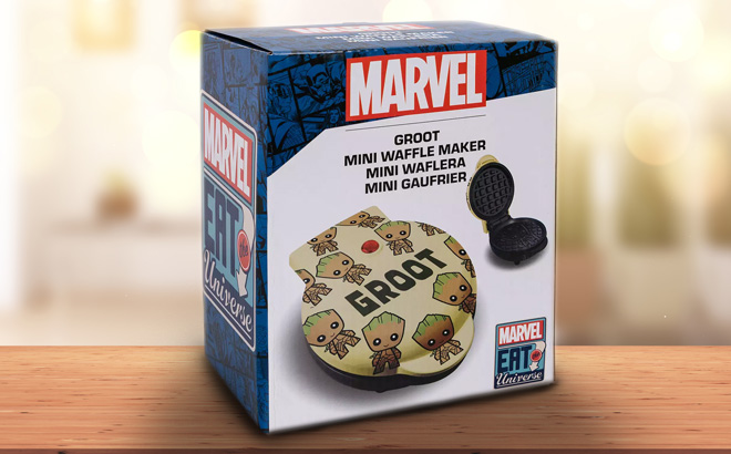 https://www.freestufffinder.com/wp-content/uploads/2023/11/Uncanny-Brands-Marvel-Eat-The-Universe-Groot-Mini-Waffle-Maker-on-a-Wooden-Table.jpg