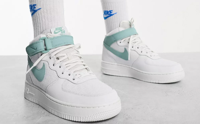 Woman Wearing Nike Nike Air Force 1 '07 Mid Shoes