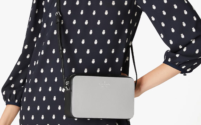 Woman is Wearing Kate Spade Sienna Crossbody in Nimbus Grey Multi Color