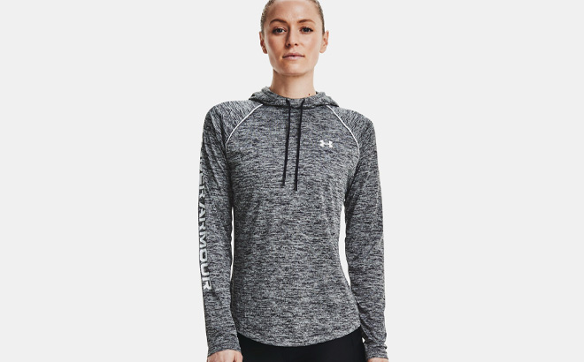 Woman is Wearing Under Armour Womens Velocity Wordmark Hoodie in Black and White Color