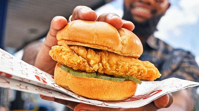 a Person Holding Pilot Flying JR Chicken Sandwich