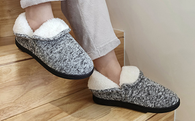 a Woman Wearing Fuzzy Slippers Booties in Gray Color