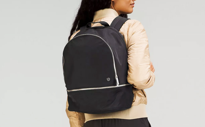 a Woman Wearing Lululemon City Advneturer Backpack