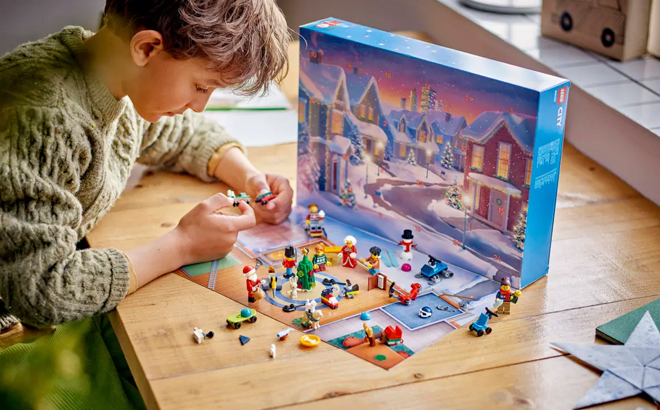 A Child Playing with LEGO City 2024 Advent Calendar on a Table