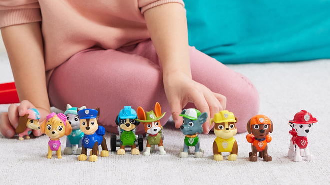 A Child Playing with PAW Patrol 10 Collectible Toy Figures