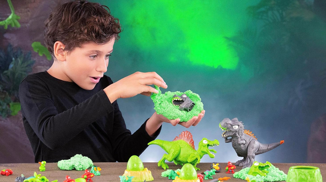 A Kid Playing with Zuru Smashers Mega Jurassic Light Up Dino Egg Toy