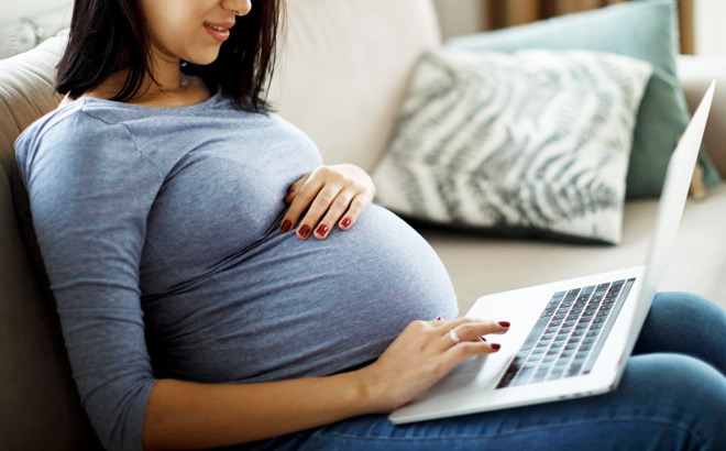 A Pregnant Woman Using Laptop at Home