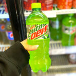 Bottle of Mountain Dew in Hand