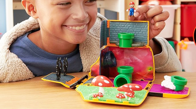 Child playing the Super Mario Bros Movie Van Playset with Figure