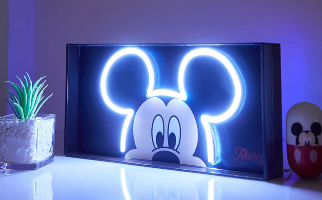 Disneys Mickey Mouse Neon LED Lamp on a Glossy Table