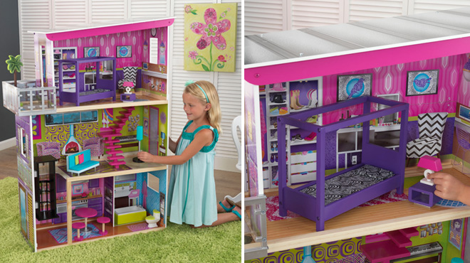 Girl Playing With KidKraft Super Model Wooden Dollhouse