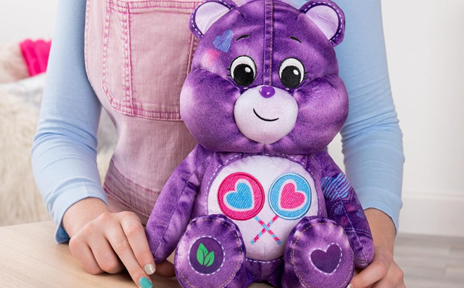 Girl is Holding Care Bear Medium Plush Share Bear