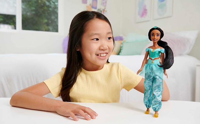 Girl is Holding Mattel Disney Princess Jasmine Doll