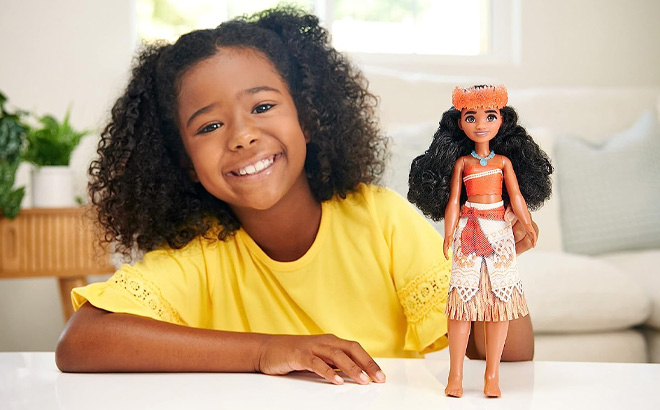 Girl is Holding Mattel Disney Princess Moana Doll