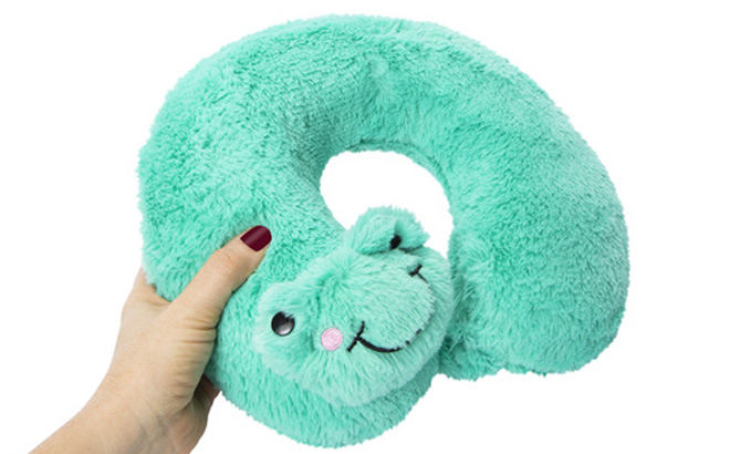 Hand Holding Critter Travel Pillow in Blue