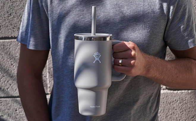 https://www.freestufffinder.com/wp-content/uploads/2023/12/Hand-Holding-Hydro-Flask-All-Around-Travel-Tumbler-with-Handle-Stainless-Steel-Double-Wall-Vacuum-Insulated.jpg