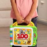 Hand Holding LeapFrog 100 Animals Book