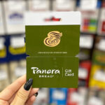 Hand Holding Panera Bread Gift Card