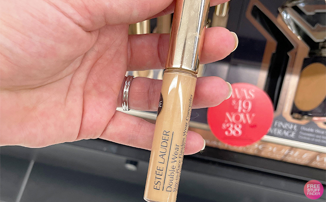 Hand Holding a Estee Lauder Double Wear Stay in Place FlawlessWear Concealers