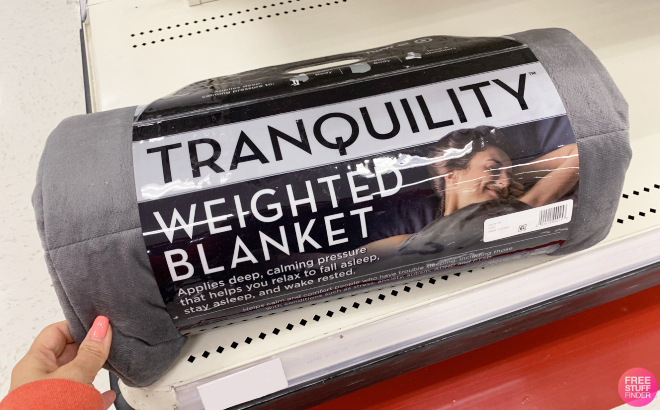 Hand Holding a Tranquility Weighted Blanket