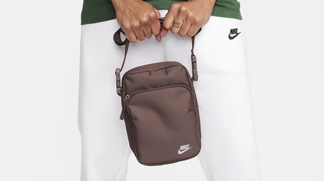 Hands Holding a Nike Heritage Crossbody Bag