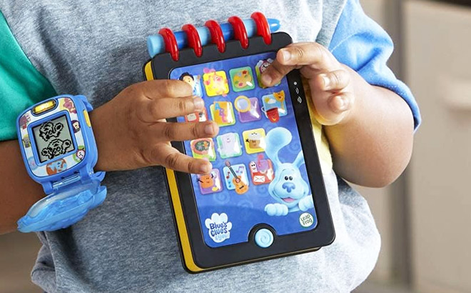 Kid Playing with LeapFrog Blues Clues You Handy Dandy Notebook