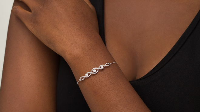 Lady Wearing Zales Diamond Accent Infinity Bolo Bracelet