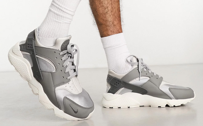 Man is Wearing Nike Air Huarache Sneakers in gray Color