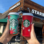 People Holding the Two Holiday Starbucks Cups in Front of Starbucks Store