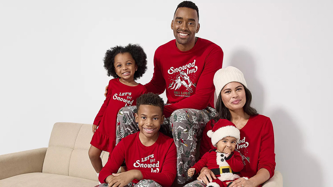 People wearing Snowed Inn Matching Family Pajamas Sets