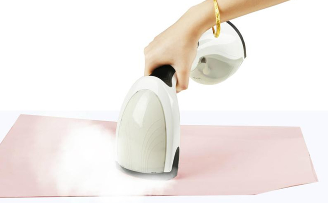 Person Using the True Tidy Steam Press Garment Steamer