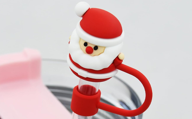 https://www.freestufffinder.com/wp-content/uploads/2023/12/Santa-Claus-Stanley-Cup-Straw-Cover-Cap.jpg