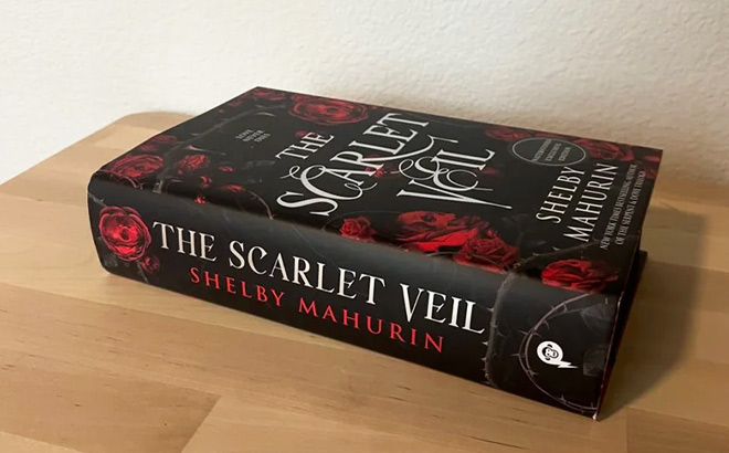 The Scarlet Veil Book on the Table