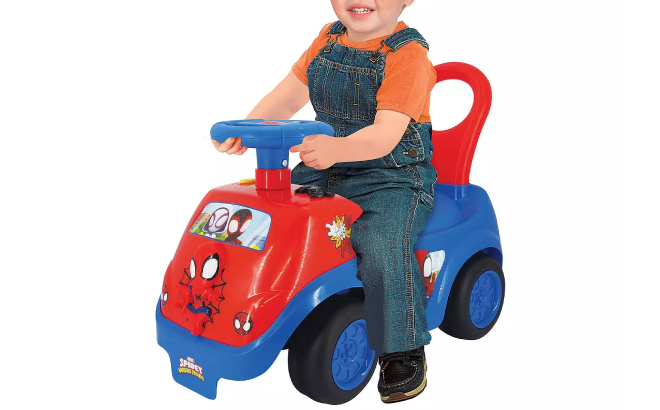 Toddler Boy Riding a Marvel Spider Man Ride On Vehicle