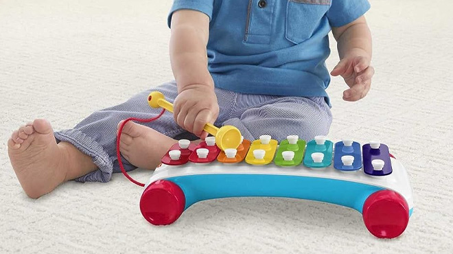 Toddler Playing with the Fisher Price Xylophone Musical Instrument Toy