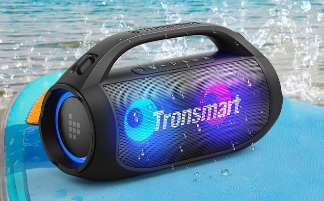 Tronsmart Bang SE Portable Bluetooth Speaker on a Surfboard