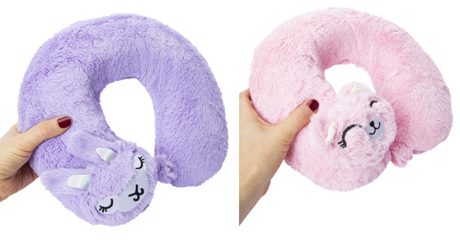 Two Hand Holding Critter Travel Pillows