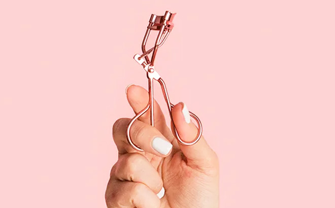 Wet n Wild Eyelash Curler Pink Background